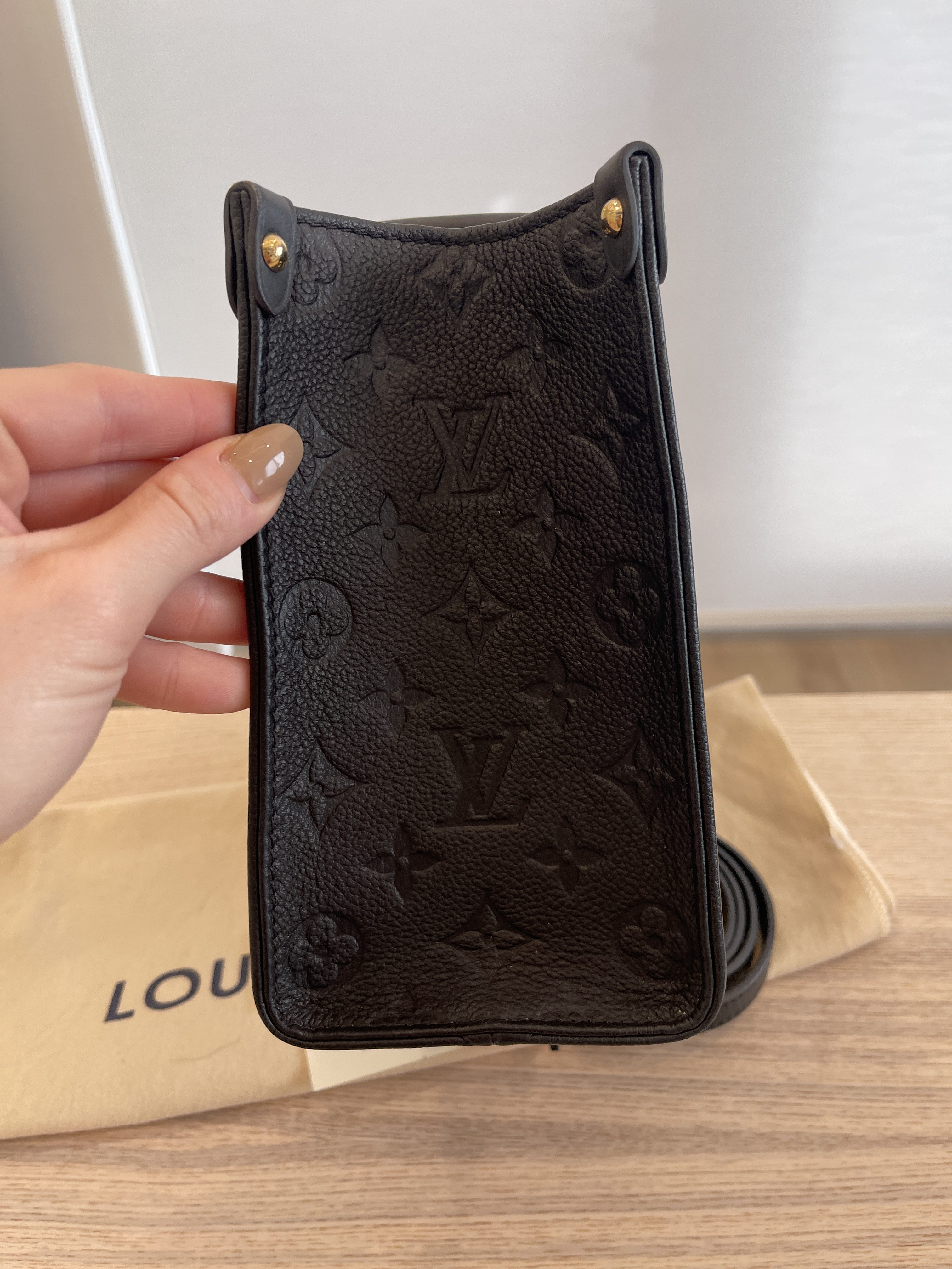 Louis Vuitton Black Giant Monogram Empreinte Leather Onthego PM, myGemma