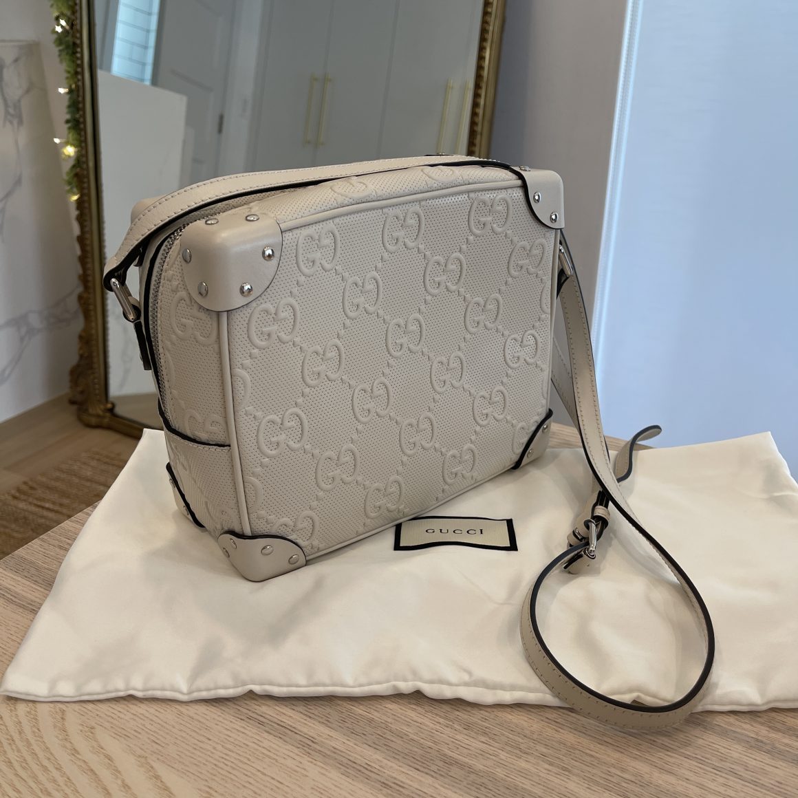 Gucci Leather Embossed GG Messenger Bag