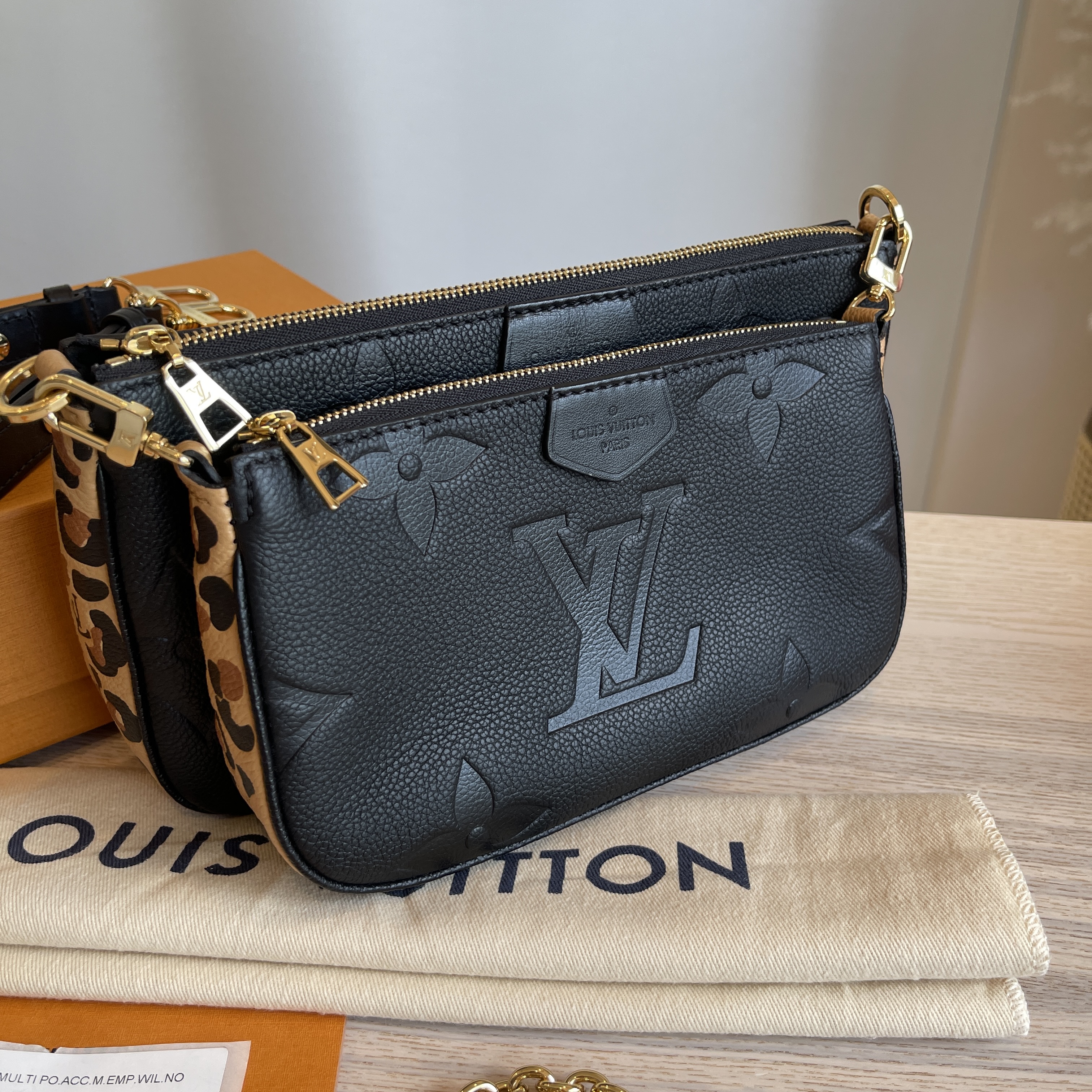 Louis Vuitton Black Monogram Empreinte Wild at Heart Melanie Pochette, myGemma, CH