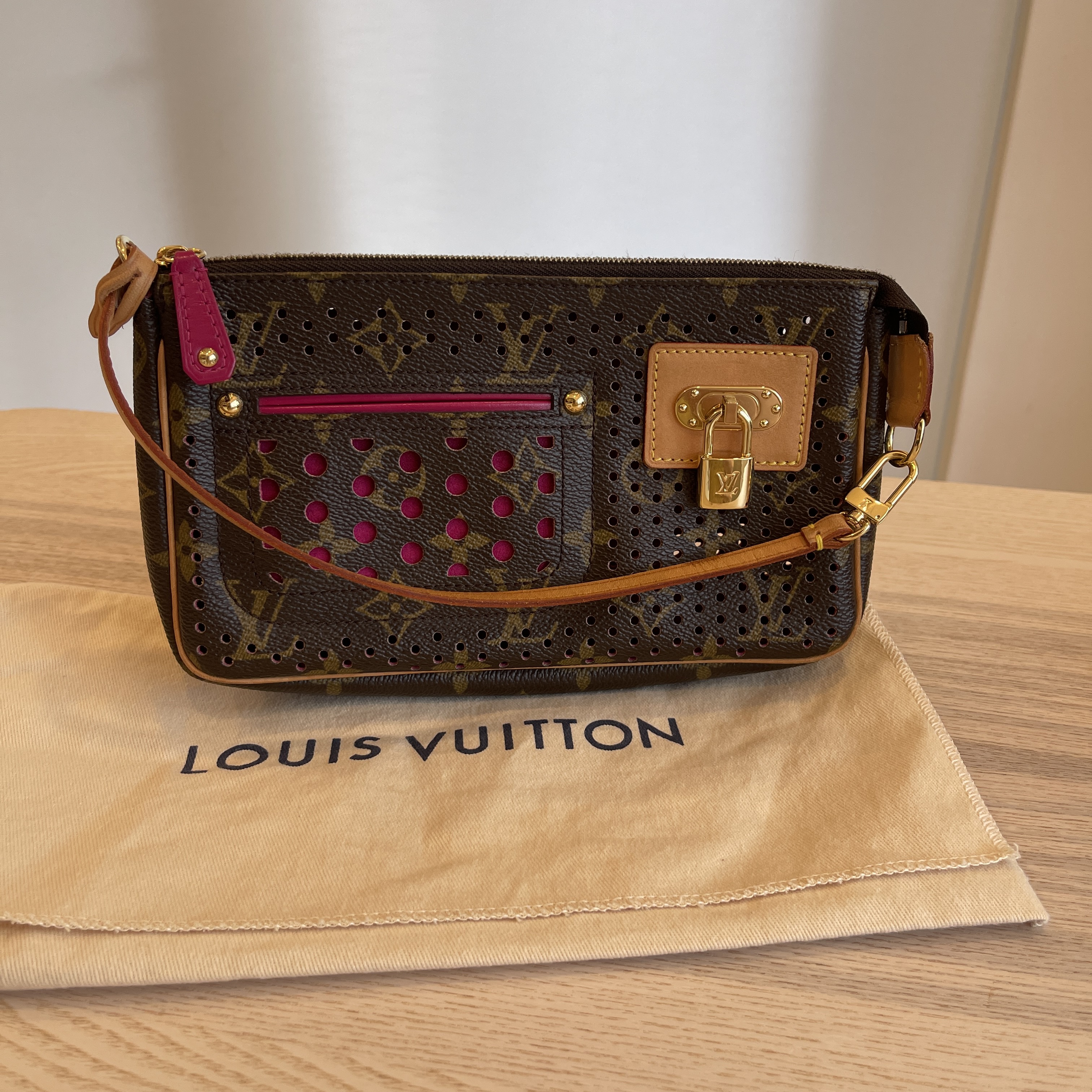 Louis Vuitton Monogram Perforated Pochette Accessories Wristlet For Sale at  1stDibs