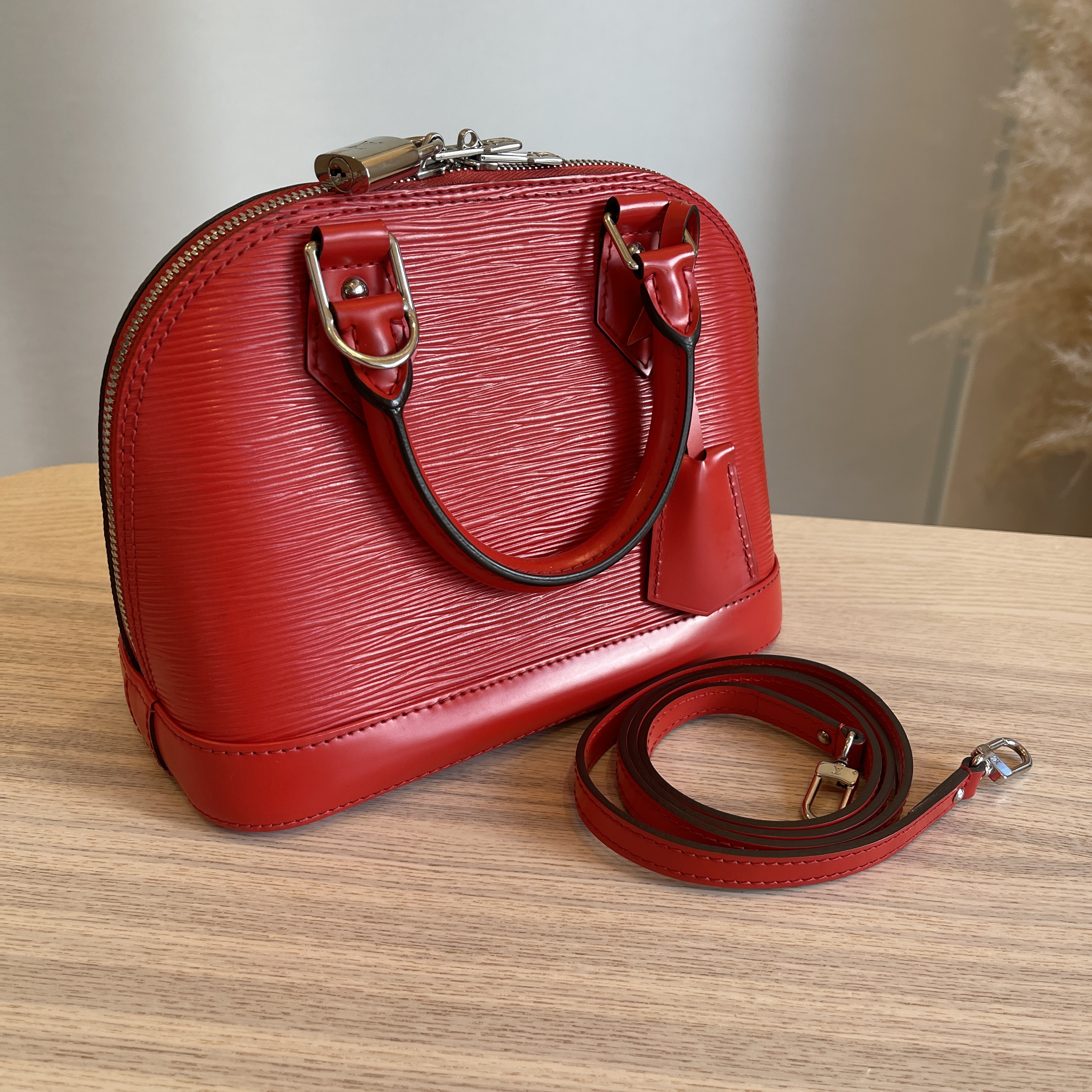 Louis Vuitton Alma PM Handbag with key clochette
