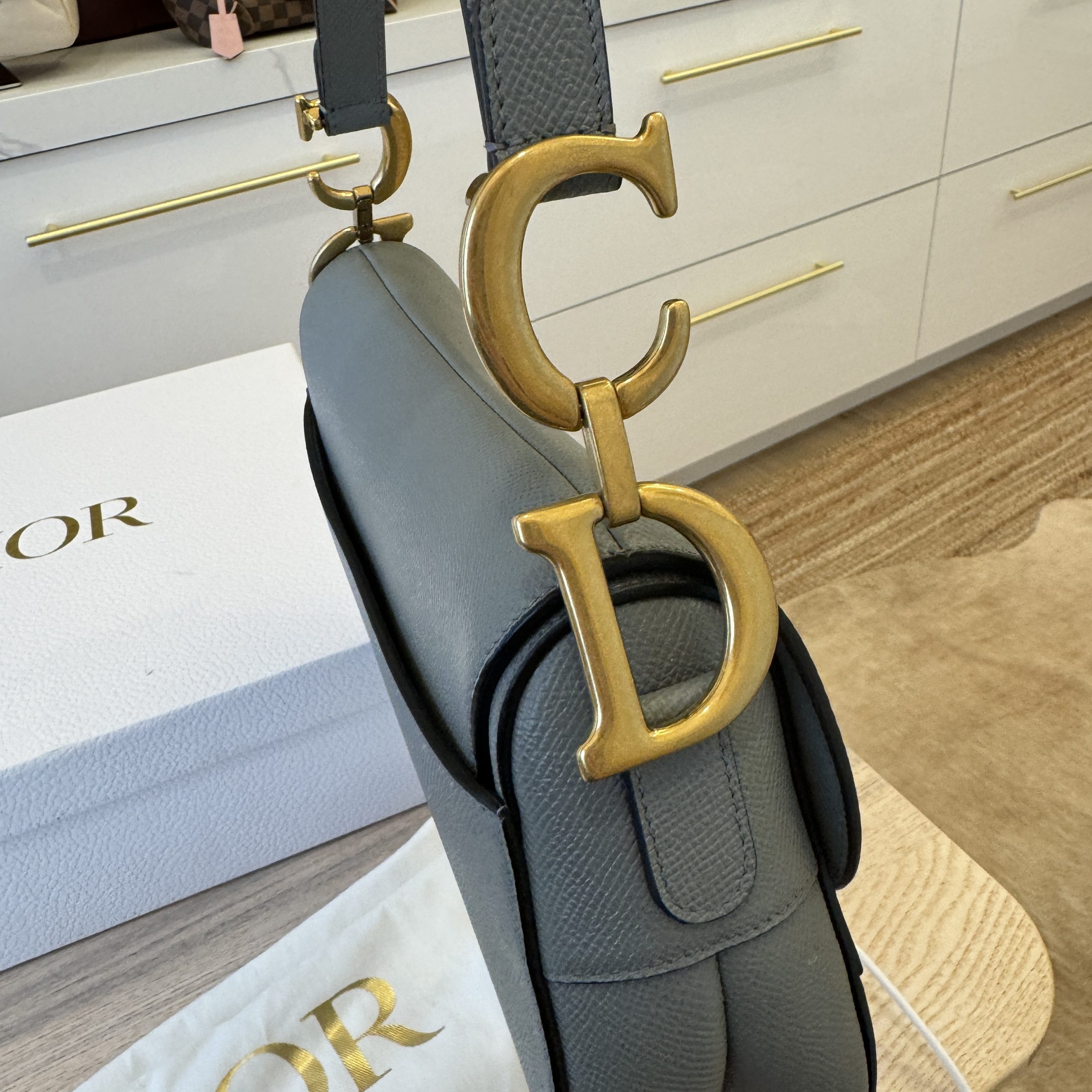 Dior saddle bag online real real